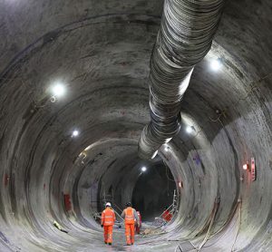 MDJV colleagues walk through the traction substation tunnel at Euston, discussing the works and the tunnel's purpose to redirect services and provide ventilation to the new traction substation, known as the Sugar Cube.