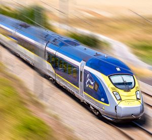 A Eurostar train at high speed in the French countryside.